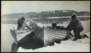 Image of MacMillan in Dory with Motion Picture Camera and Polar Eskimo [Inughuit] after a Seal Hunt